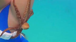 Beatifull girl sexy snorkeling with here octopus friend