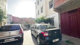 The cat sleeping on top of the car couldn't stop showing his happiness at seeing us.