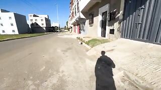 This cute stray cat talked to me with the longest meow to ask for food.