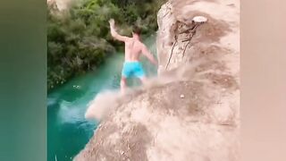 A person making High jump and falls on river