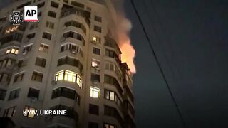 Kyiv high-rise burns after overnight Russian strike in Ukraine.