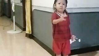 Cute Kid Playing Lato-Lato Toy – Fun and Nostalgic Moments