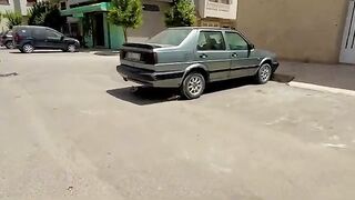 Cats sleeping sweetly under the car are very cute.