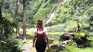 This breathtaking waterfall, surrounded by lush greenery