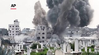 AP captures Israeli army striking a building in Gaza City.