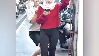 A man make fun with a woman on the Street