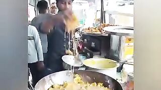 How a guy put his hand into the hot oil and cook