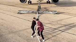 How many people to pull a plane