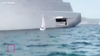 Frantic family in tiny boat crash into Russian tycoon’s gigantic £360m superyacht