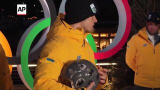 IOC disqualifies Ukraine athlete from Olympics race due to banned helmet.