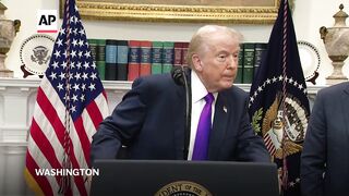 Trump says he didn't fire staffer who posted racist video of Obamas.