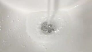 The cat still thinks it's a kitten and meows during bath time.,