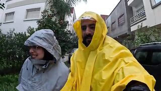 This couple braves a fierce rainstorm to rescue stray animals.