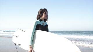 The Pioneer Woman - woman carrying surfboard walking | Trending HD Video