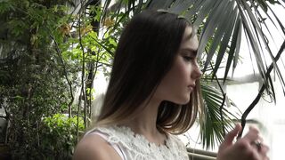 The Pioneer Woman - a young female model posing among plants in a greenhouse | Trending HD Vide