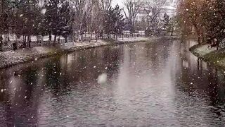 Naturehike - tranquil snowfall over a picturesque river | Trending HD Video