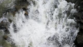 NaturesPlus - top view of water flowing over rocks | Trending HD Video
