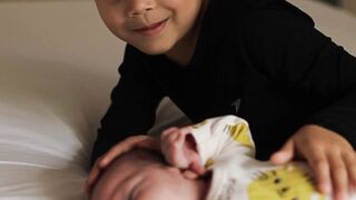 Baby Toys - adorable sibling bonding moment on bed | Trending HD Video