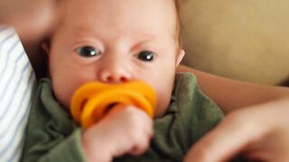 Baby Toys - a mother cutting her baby s fingernails | Trending HD Video