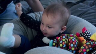 BabyBj rn - mom reading baby a book | Trending HD Video