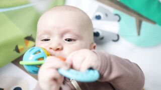 BabyBj rn - baby biting a toy | Trending HD Video