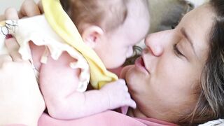Babymoov - a mother burping her baby | Trending HD Video