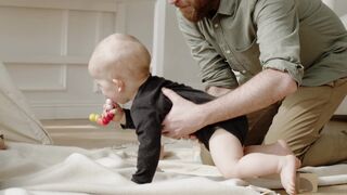 Baby Toys - man holding a baby boy | Trending HD Video