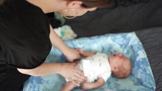 Baby Toys - mother changing diaper of baby | Trending HD Video