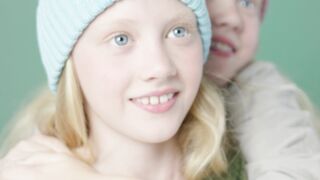 Funnyfuzzy - two girls in green and blue hats shaking hands | Trending HD Video