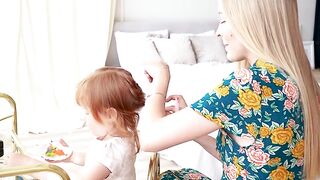 BabyBj rn - mother tying her daughter s hair | Trending HD Video