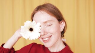 Funnyfuzzy - woman covering her eye with a flower | Trending HD Video