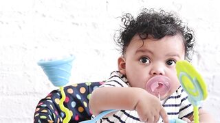 BaByliss - a baby sucking a pacifier | Trending HD Video