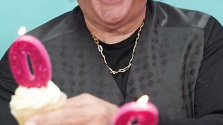 Notes on Being a Man - a smiling man holding cupcakes with candles | Trending HD Video