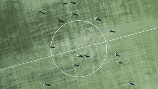 Action figure - aerial view of soccer game on green field | Trending HD Video