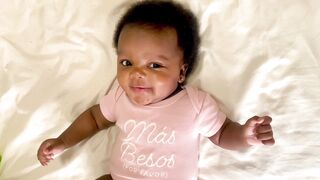 Babymoov - adorable baby in pink outfit with smile | Trending HD Video