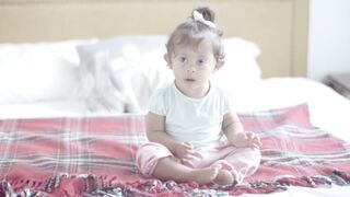 Baby Toys - a happy baby sitting on the bed | Trending HD Video