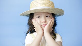 Funnyfuzzy - a little girl in a straw hat with her hands on her face | Trending HD Video
