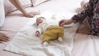 BabyBj rn - a baby lying down on bed | Trending HD Video