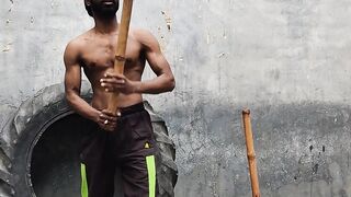 Action figure - intense workout with gada in industrial setting | Trending HD Video