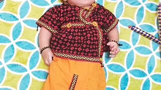 Babymoov - a baby is laying on a colorful rug | Trending HD Video