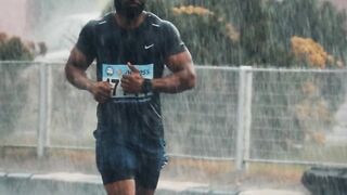 Action figure - athlete running in the rain during lagos city marathon | Trending HD Video