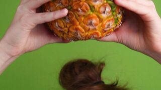 Funnyfuzzy - a woman placing a pineapple over her head | Trending HD Video