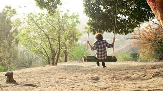 Action figure - a boy swinging under the tree | Trending HD Video