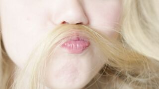 Funnyfuzzy - a girl with long blonde hair is holding her hair | Trending HD Video
