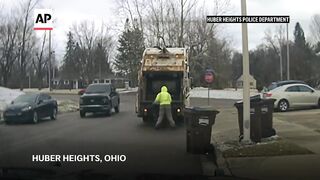 Ohio police chase suspect after sanitation worker finds him in a trash can.