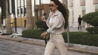 Action figure - fashionable woman walking in urban summer setting | Trending HD Video