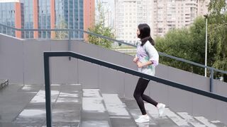 Action figure - woman running through the stairs | Trending HD Video