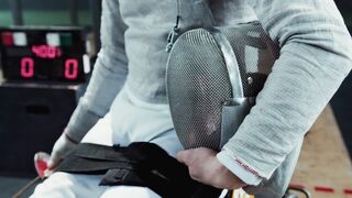 Action figure - a bearded man holding a fencing mask and a sabre | Trending HD Video