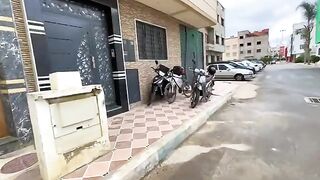 A cat sleeping on a motorcycle is surprised by attention and delicious food.