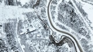 Wonder Woman - aerial view of a road in a snowy landscape | Trending HD Video